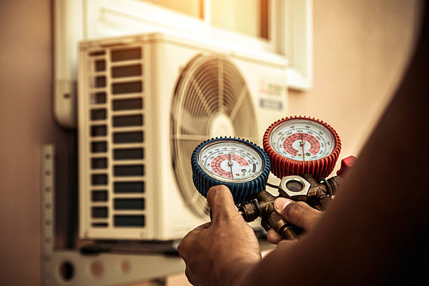 Professional Air Conditioning Service technician working in Larimore, ND